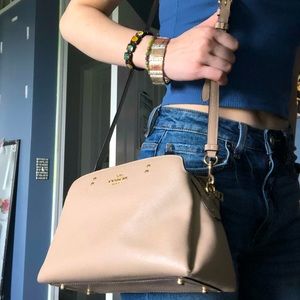 Midsize mauve colored coach purse